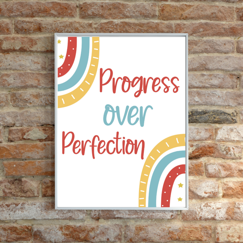 'Progress Over Perfection' wall poster on a white background on display